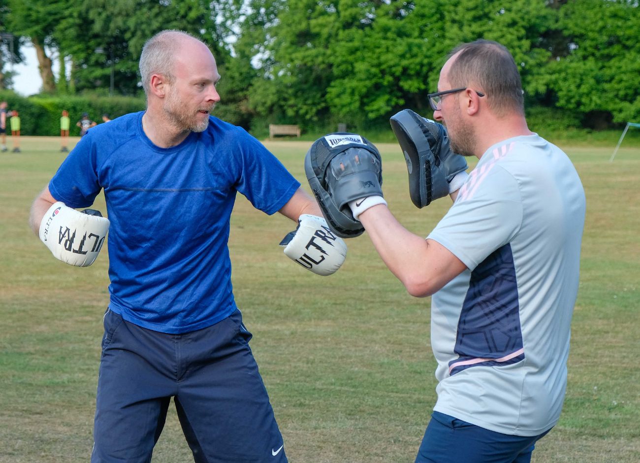 men boxing at bootcamp