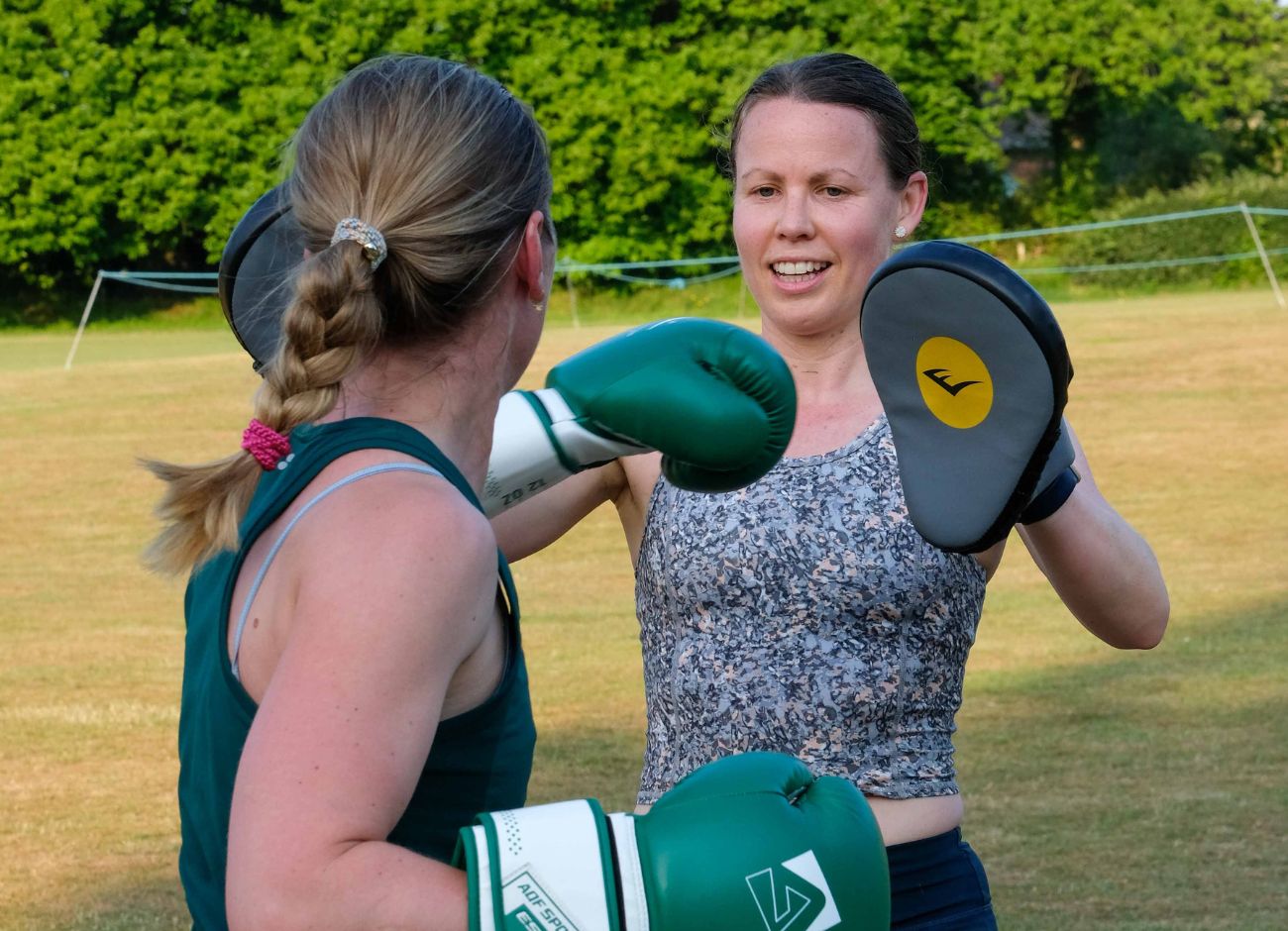 Women boxing at bootcamp